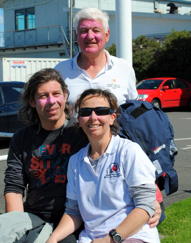 Outgoing president of the International Dragon Association, Robert Campbell (back) still wearing pink sunburn cream and his crew on Indulgence, Rene Nel and Simon Cash at the RYCT.  - Prince Philip Cup Regatta 2012 © Rob Cruse
